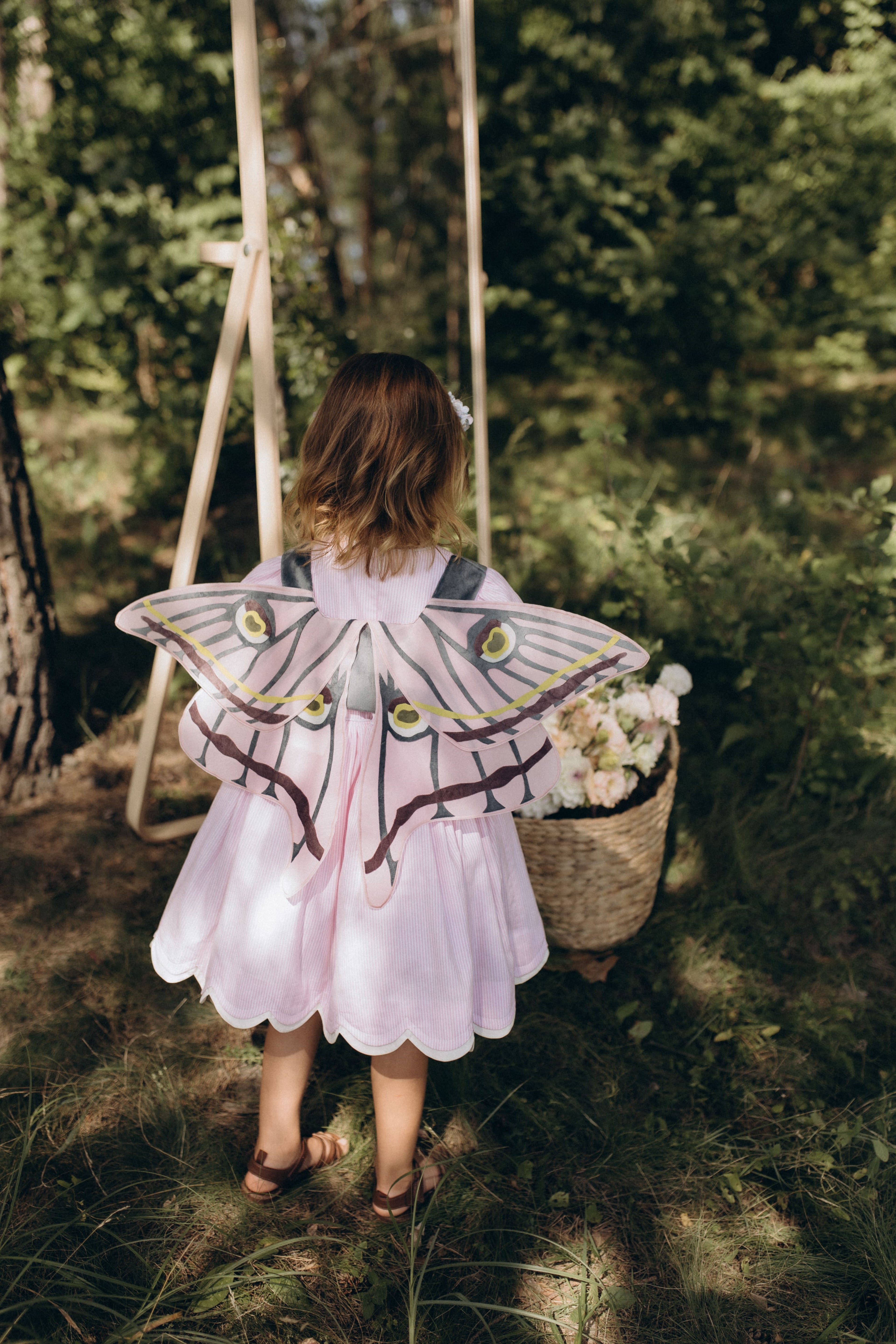 Крила на жилетці блакитно-рожеві