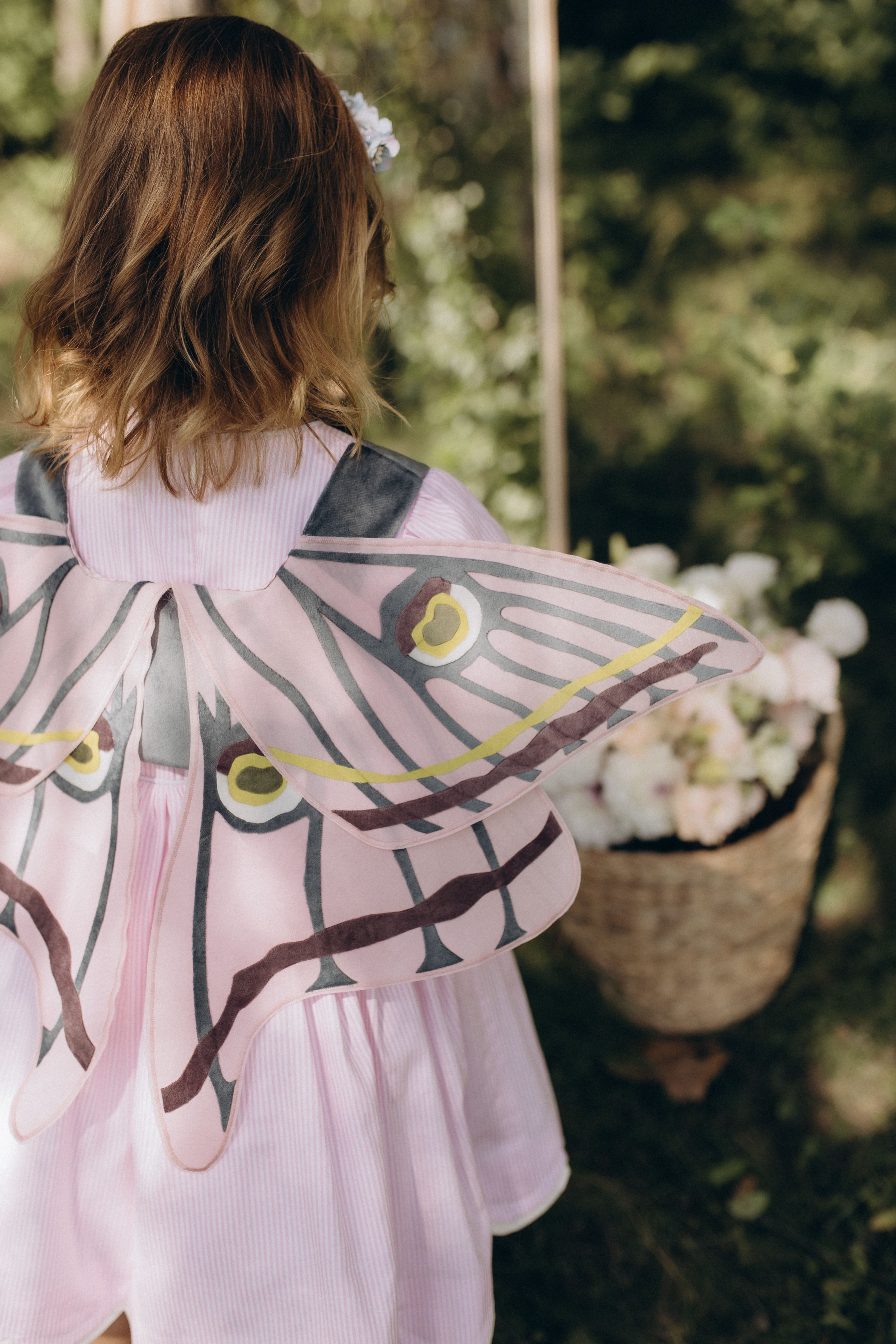 Крила на жилетці блакитно-рожеві