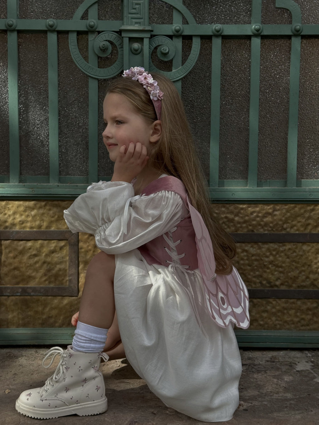 Крила на корсеті рожеві